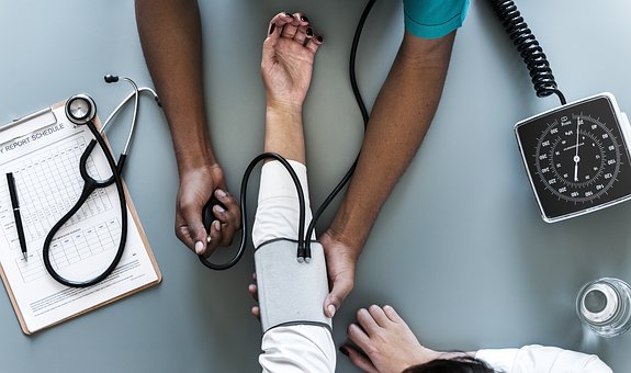 blood pressure cuff on arm