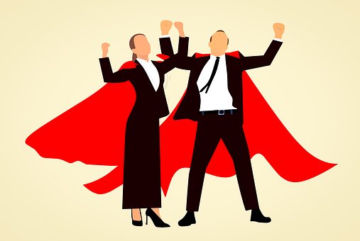 man and woman wearing superhero capes
