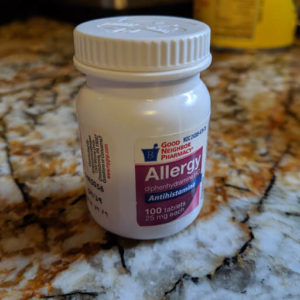 An over-the-counter bottle of generic Benadryl. 