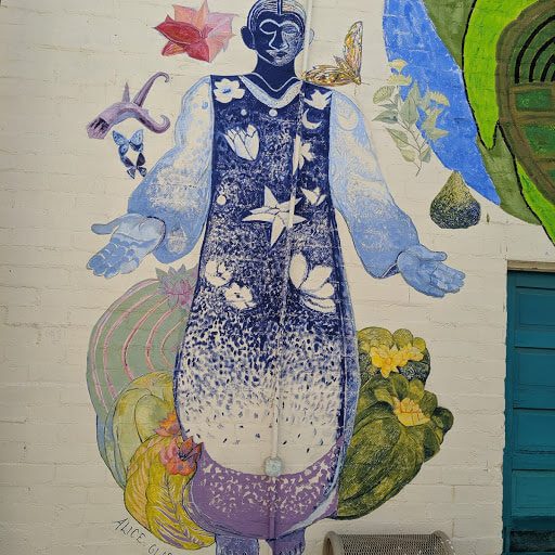 mural of a man enriched by the products of the desert - Ajo, AZ.