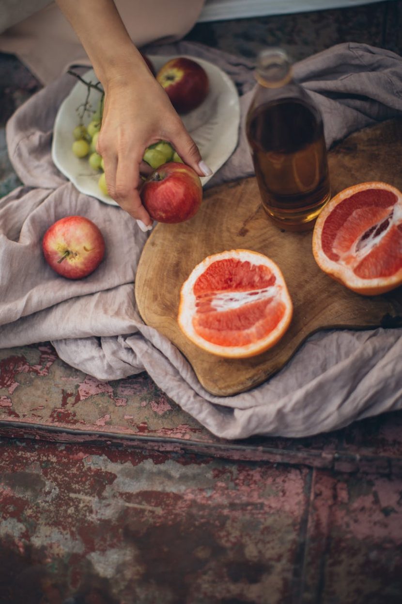 Fruit on and around a platter.