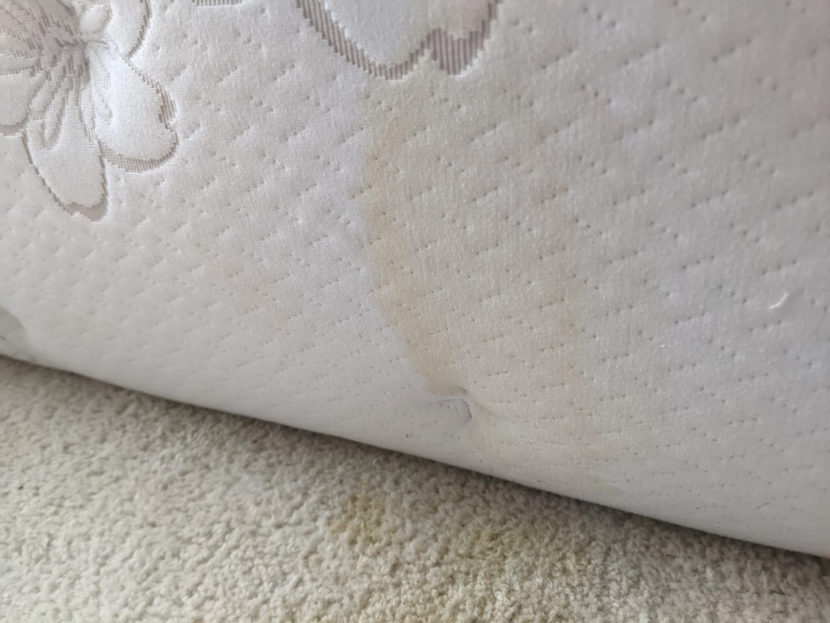 old mattress with a stain
