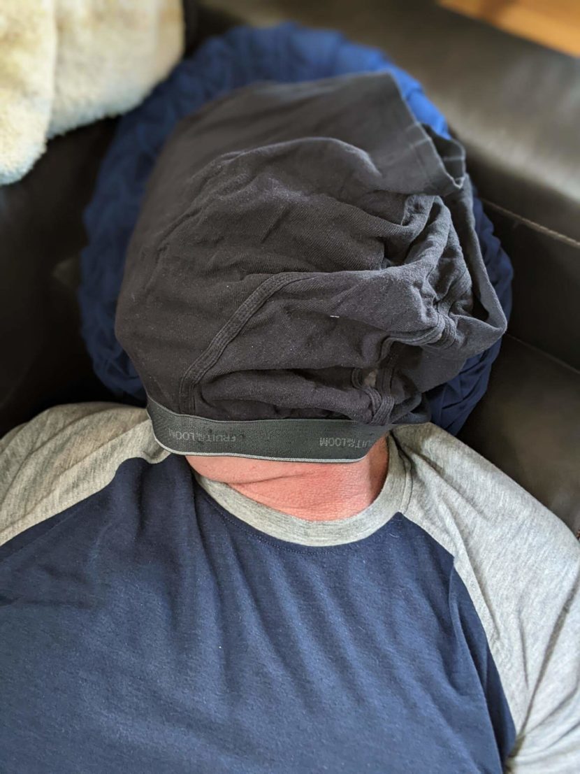 Improvised sleep mask is underwear worn on head.