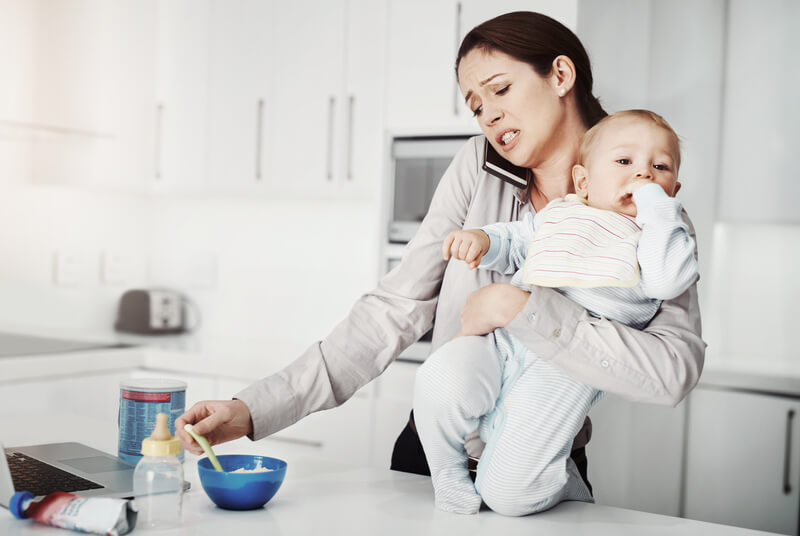 multitasking mother and baby